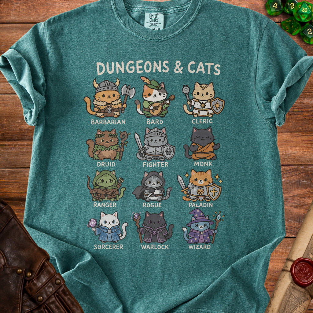 T-shirt with "Dungeons & Cats" text and illustrations of cats in fantasy roles.