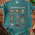 T-shirt with "Dungeons & Cats" text and illustrations of cats in fantasy roles.