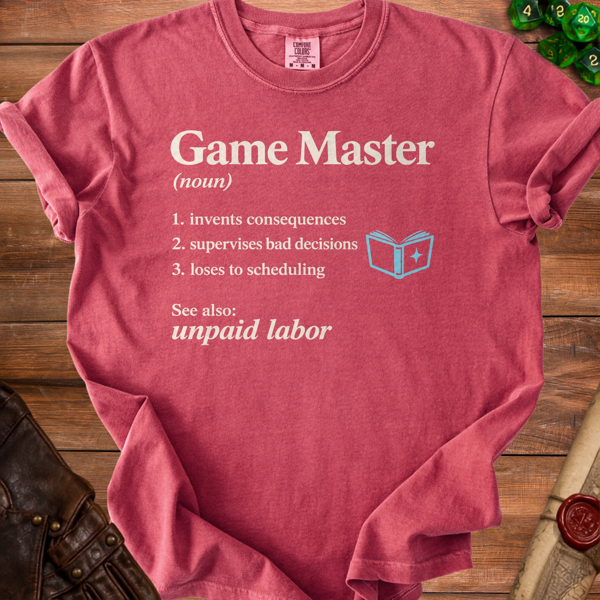 Red t-shirt with white text defining "Game Master" and "unpaid labor".