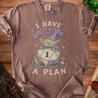 Brown t-shirt graphic: goblin wizard on d20 die, text "I have had A PLAN".