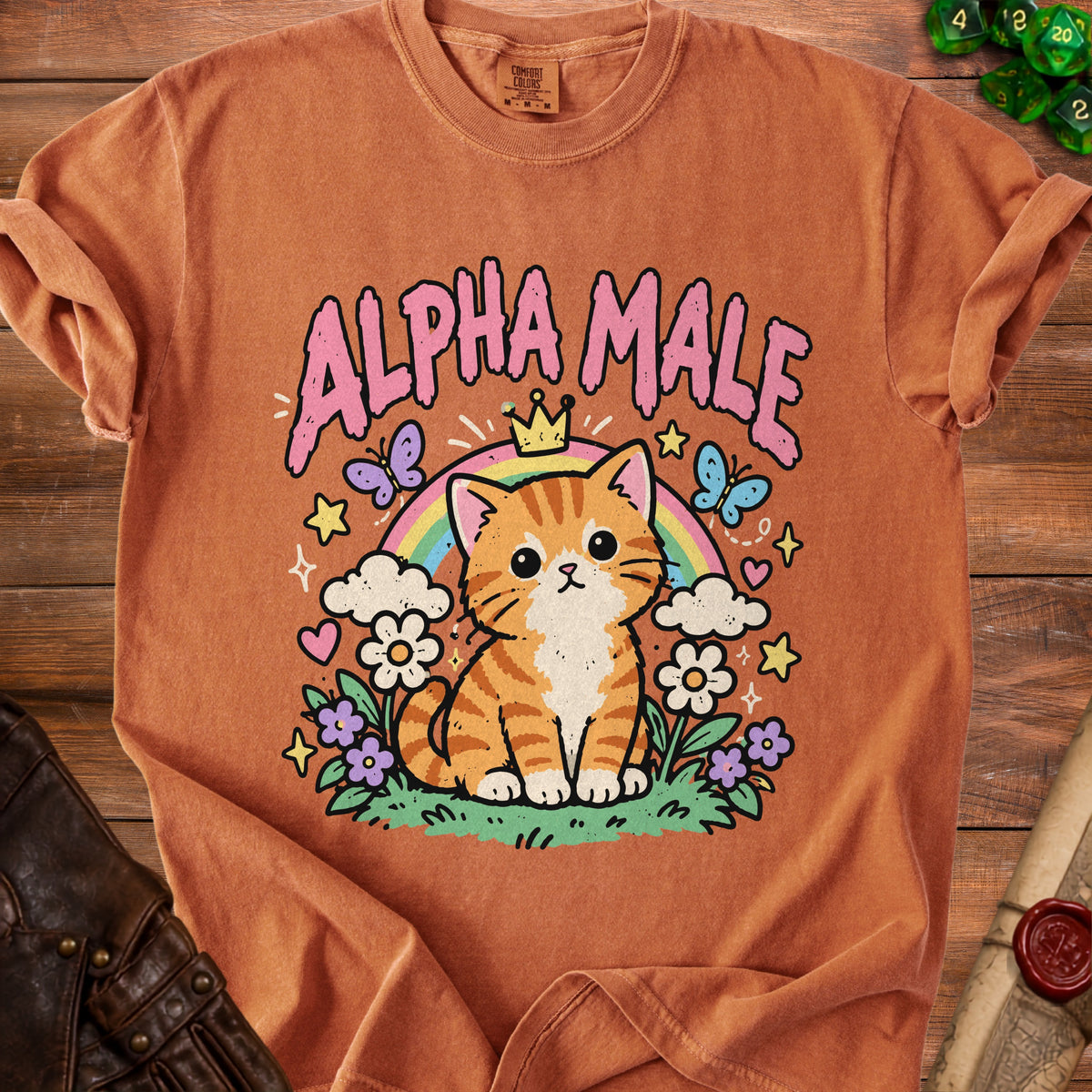 Orange t-shirt with a cartoon kitten wearing a crown and the text "ALPHA MALE".