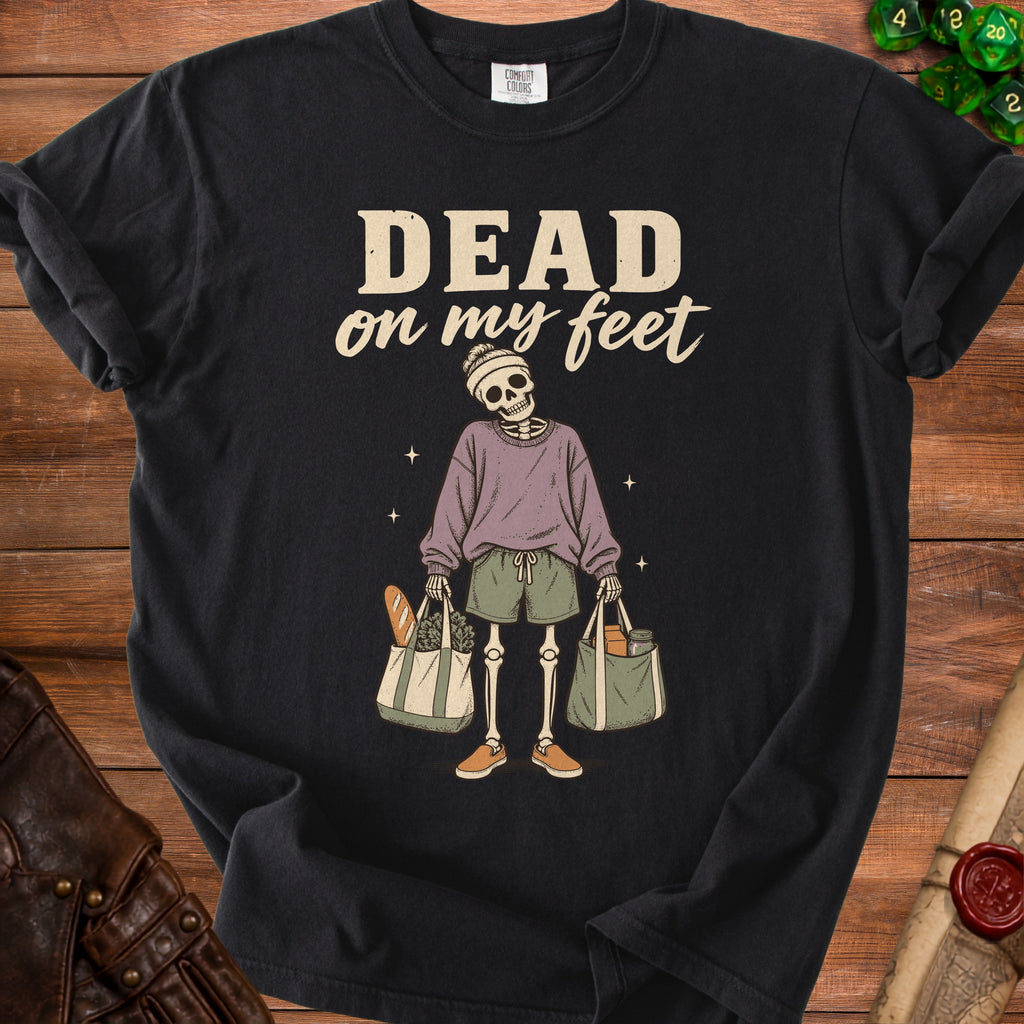 Black t-shirt with "DEAD on my feet" text and skeleton holding grocery bags.