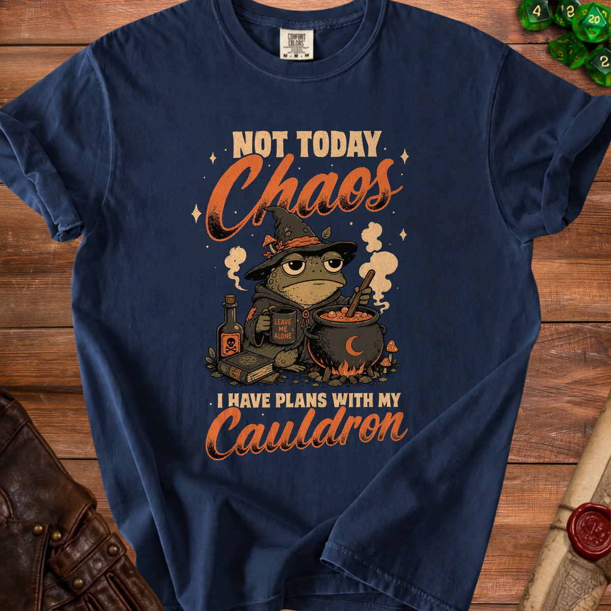 T-shirt with a witchy frog, cauldron, and the text "Not Today Chaos, I Have Plans With My Cauldron."