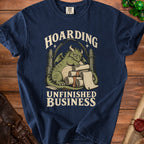 Navy t-shirt with dragon design and text "HOARDING UNFINISHED BUSINESS".