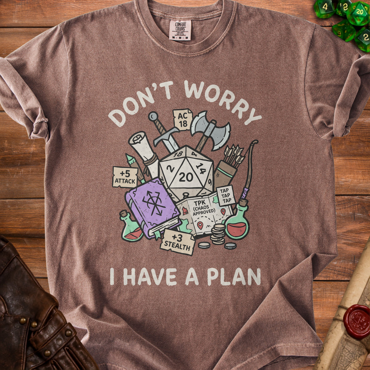 Brown t-shirt with Dungeons and Dragons dice, weapons, spellbook, and text "Don't Worry I Have a Plan".