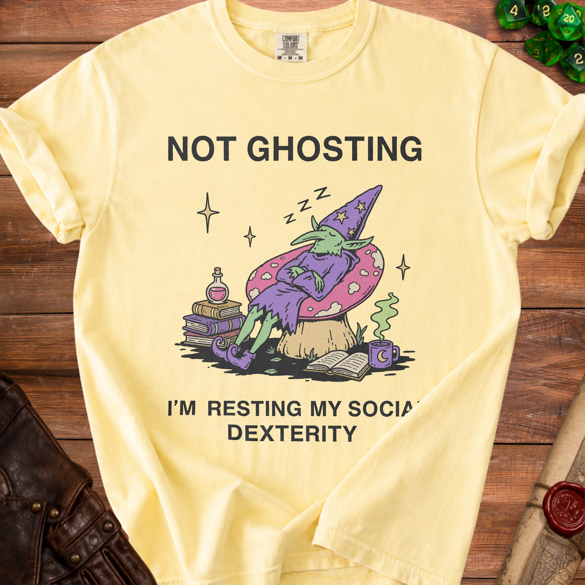 Yellow t-shirt with "Not Ghosting I'm Resting My Social Dexterity" and sleeping wizard graphic.