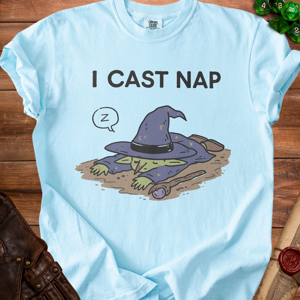 Light blue t-shirt with a graphic of a sleeping wizard and text "I CAST NAP".