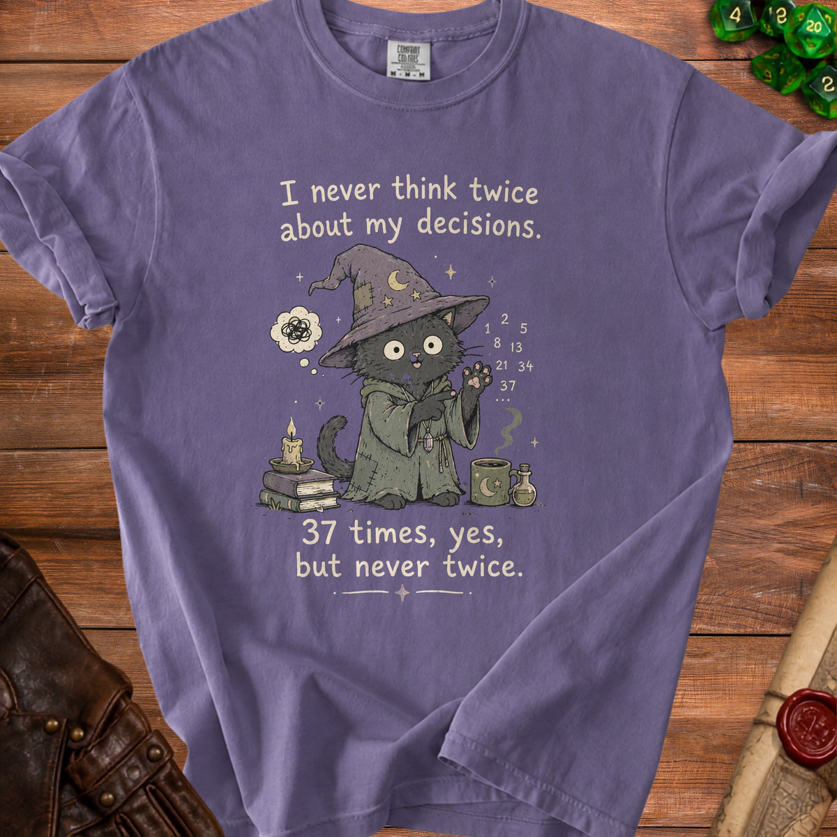 Purple t-shirt with a wizard cat graphic and text.