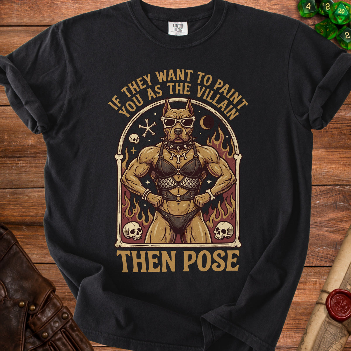 Black t-shirt with pitbull wearing sunglasses and leather outfit, text "If they want to paint you as the villain then pose".