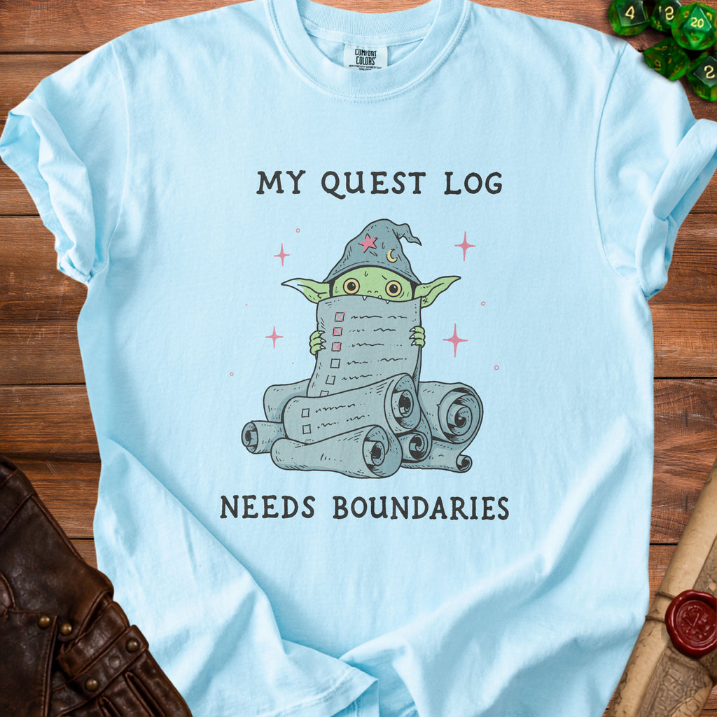Light blue t-shirt with a goblin holding a quest log that reads "MY QUEST LOG NEEDS BOUNDARIES".