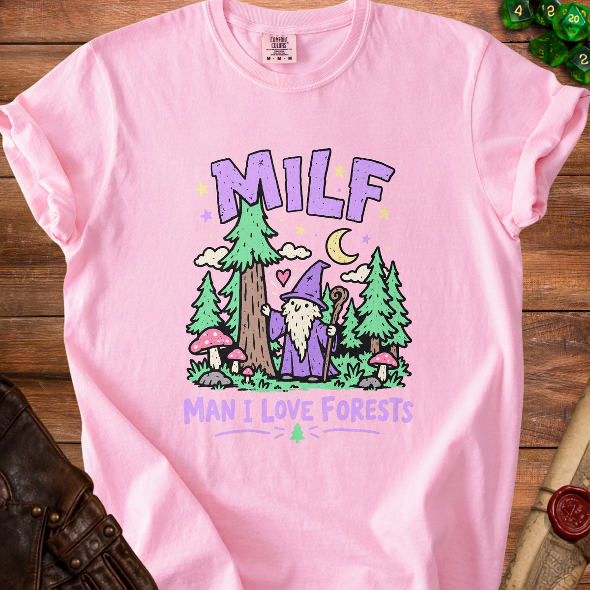 Pink t-shirt with "MILF MAN I LOVE FORESTS" text and forest wizard graphic.