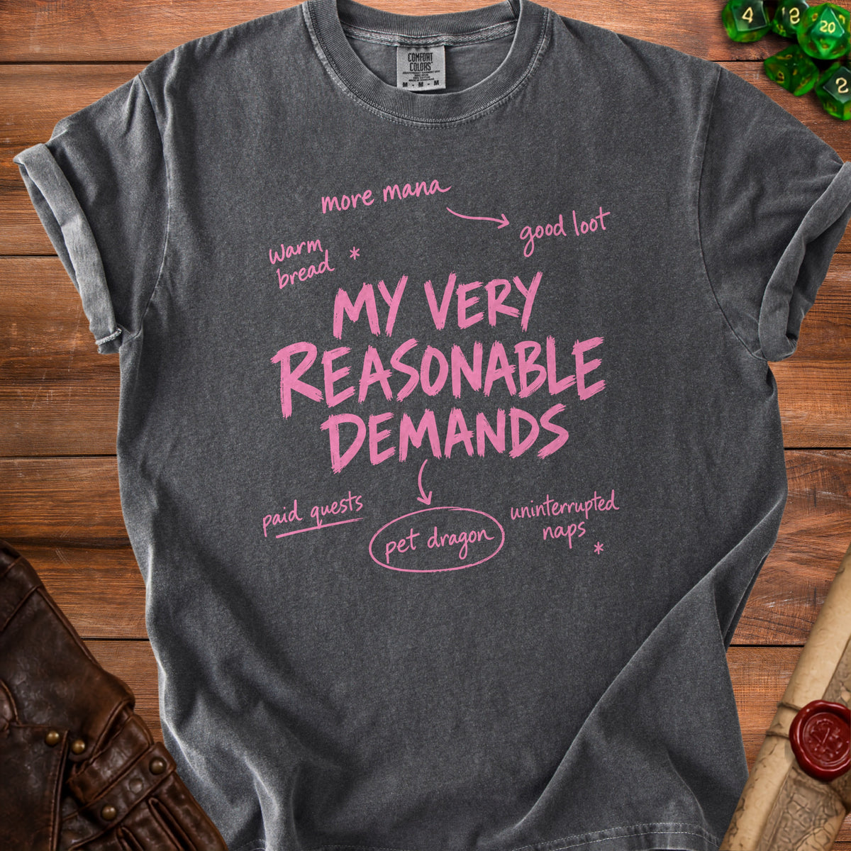 Dark gray t-shirt with pink text "MY VERY REASONABLE DEMANDS" and related phrases.