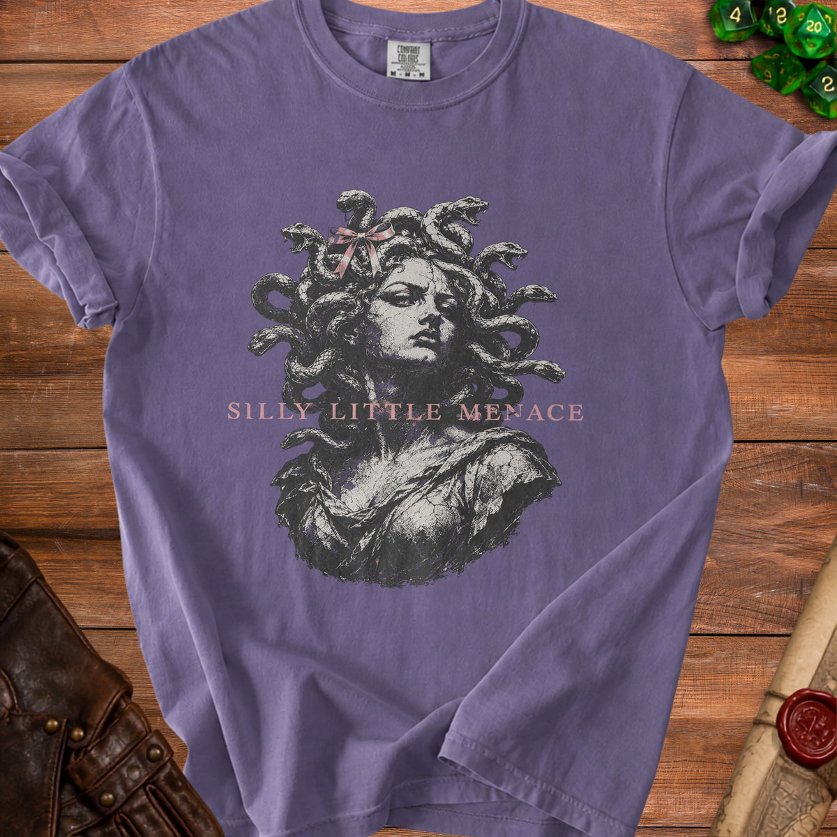 Purple t-shirt with Medusa graphic and text "Silly Little Menace".