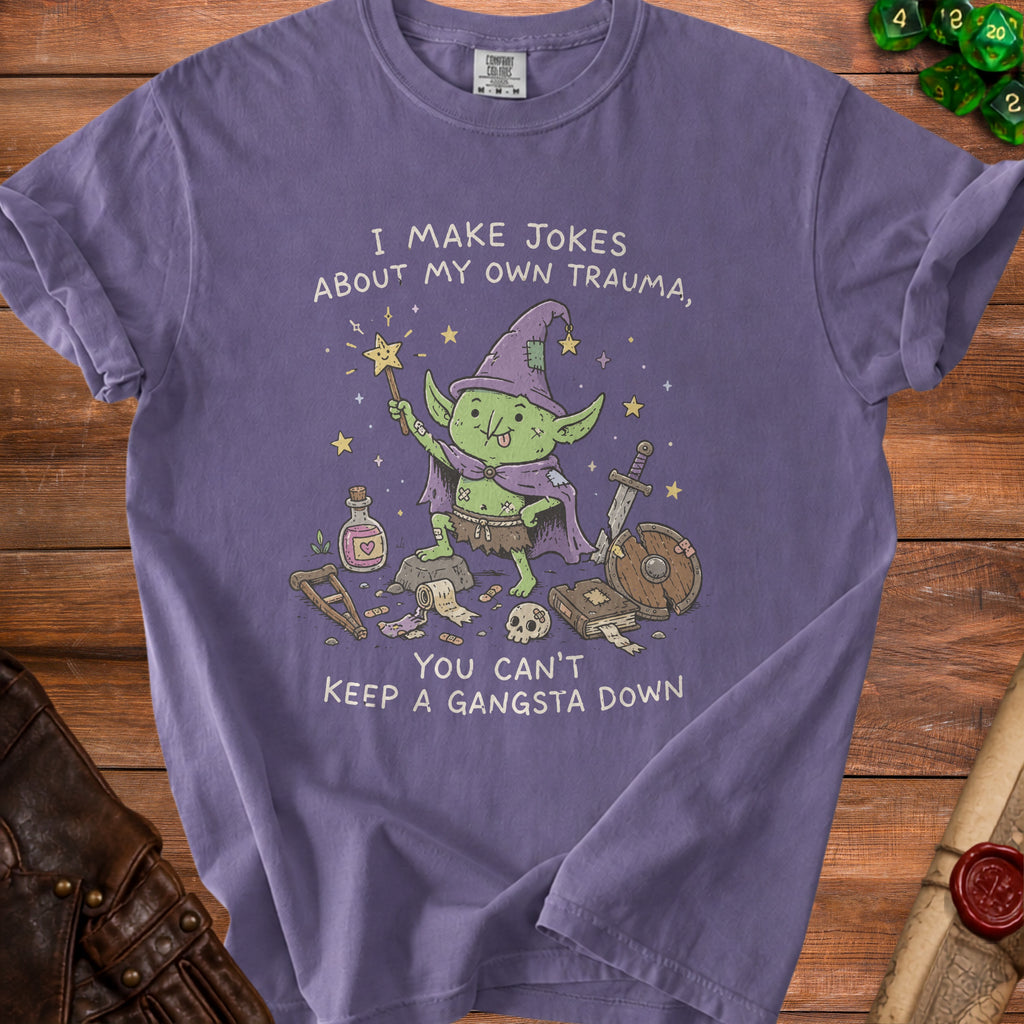 Goblin with wand, sword, shield, and text "I make jokes about my own trauma, you can't keep a gangsta down".