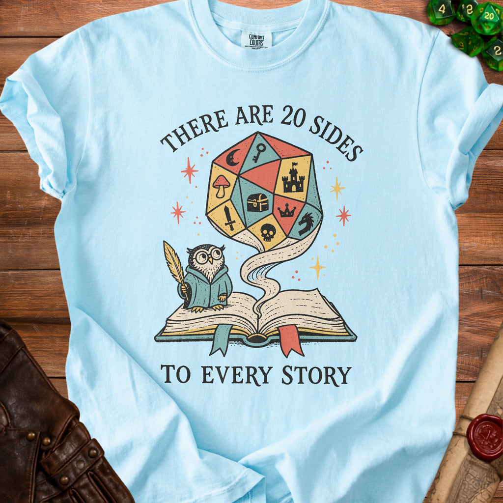 Light blue t-shirt with graphic of owl and d20 dice, reading "There are 20 sides to every story."