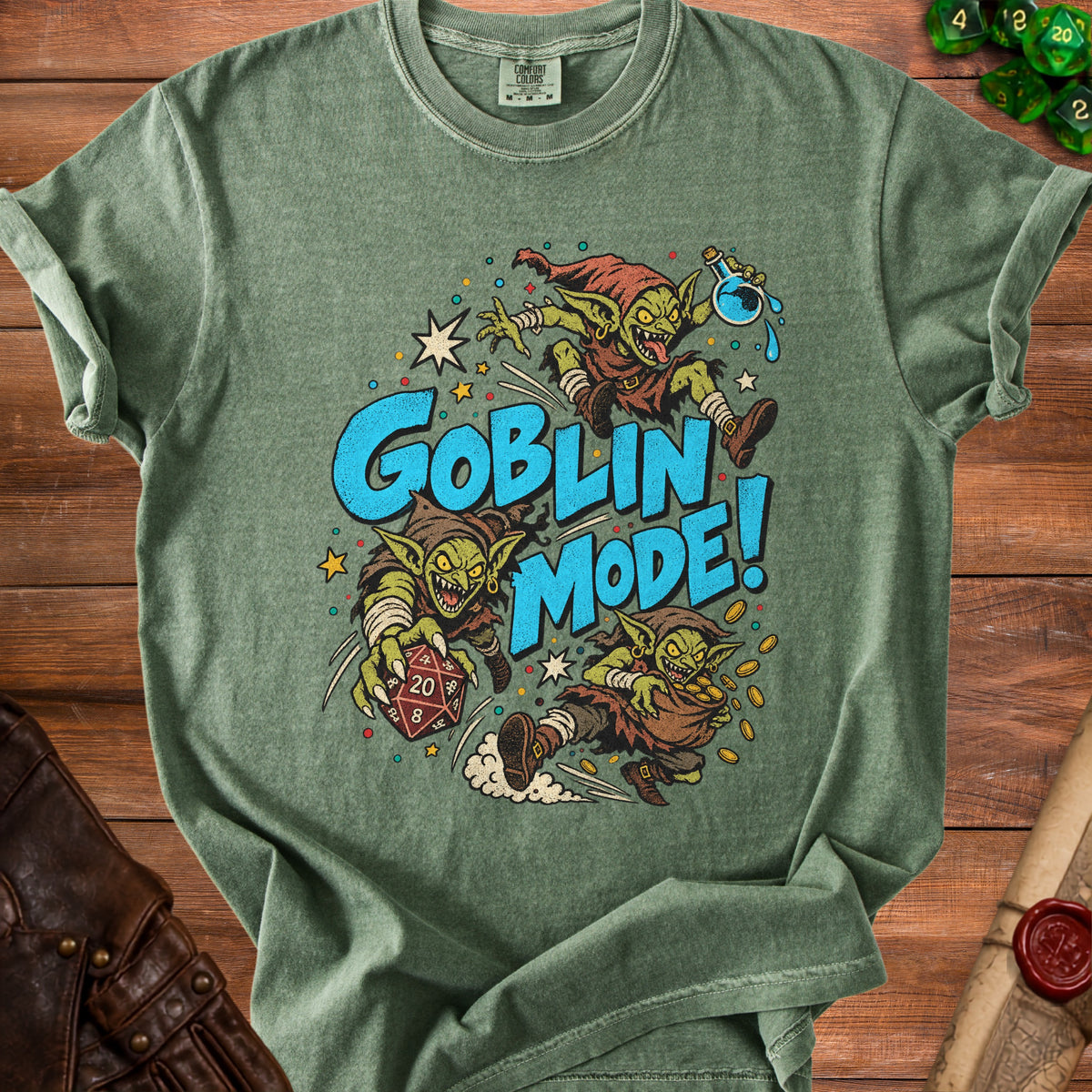 Green t-shirt with three goblins and "Goblin Mode!" text, holding dice and coins.