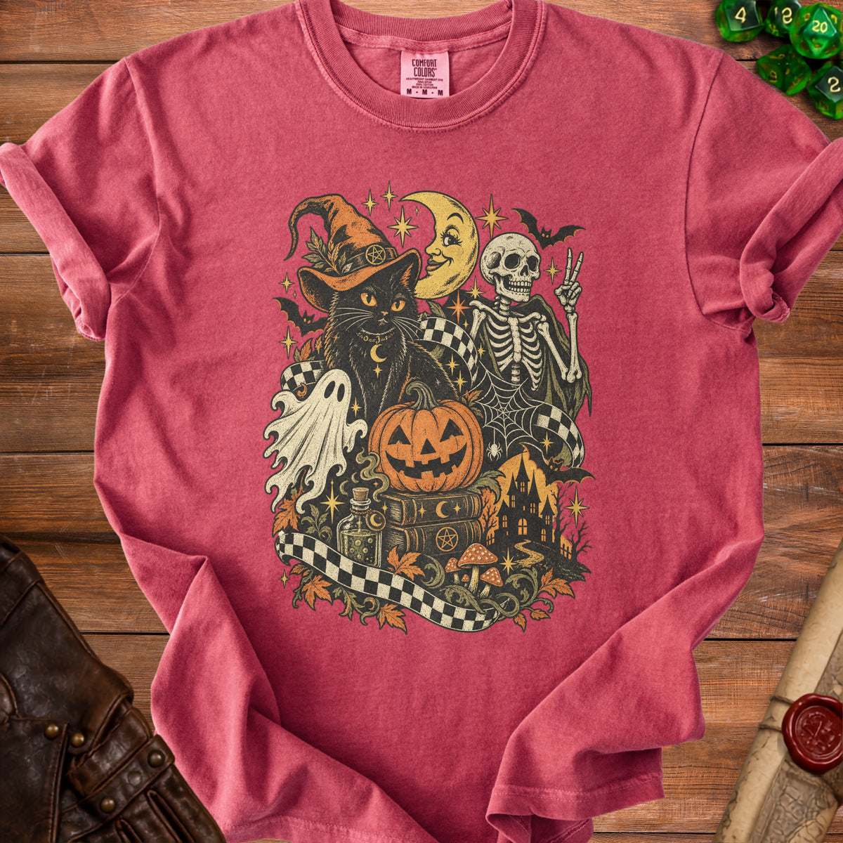 Halloween graphic tee with black cat, skeleton, pumpkin, and haunted house.