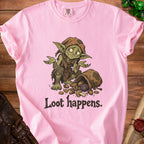 Pink t-shirt with a goblin holding a D20 die and scattered coins. "Loot happens." text.