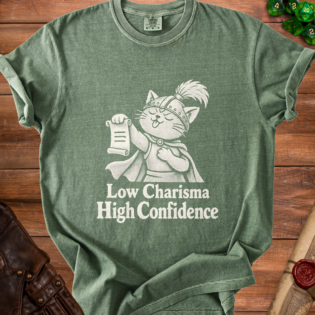 Green t-shirt with white print of a cat knight holding a scroll, saying "Low Charisma High Confidence".
