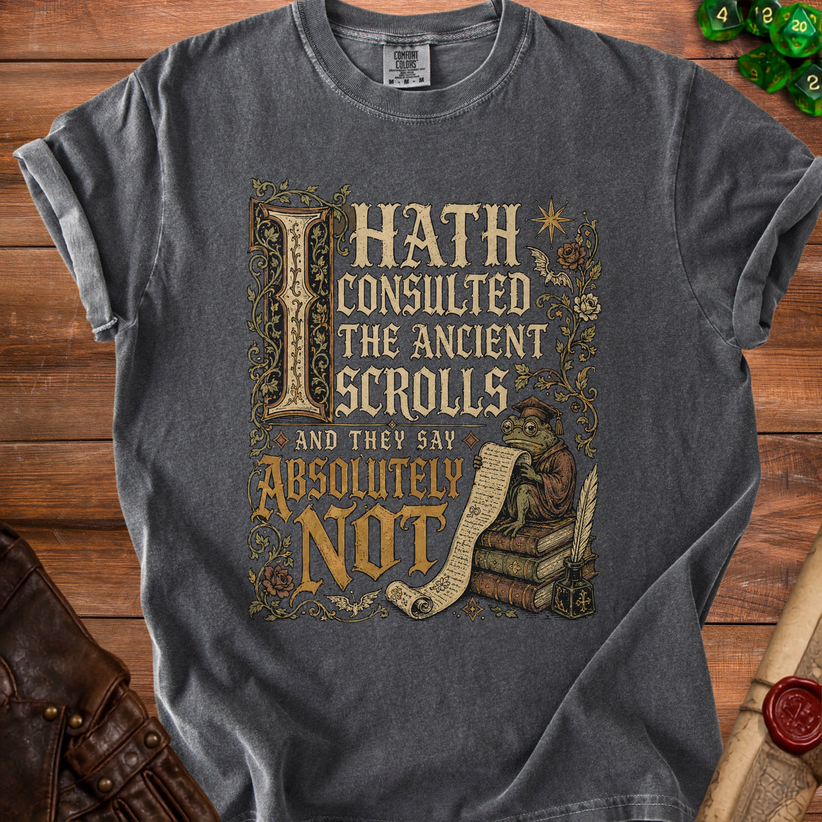 Dark gray t-shirt with medieval-style graphic: frog reading scrolls, "I Hath Consulted the Ancient Scrolls and They Say Absolutely Not".