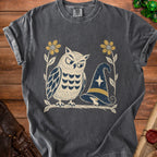 Grey t-shirt with graphic of an owl and a witch hat on a branch.
