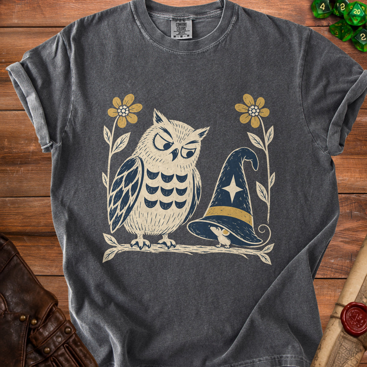 Grey t-shirt with graphic of an owl and a witch hat on a branch.