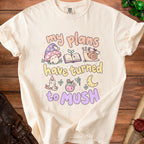 Cream t-shirt with "My plans have turned to mush" text and whimsical illustrations.