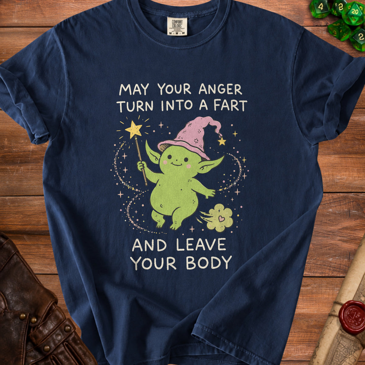 Green goblin with magic wand and hat on navy shirt with text "May your anger turn into a fart and leave your body".