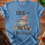 Blue t-shirt with text "IBS- I Be Slayin'" and a green creature in a witch hat.