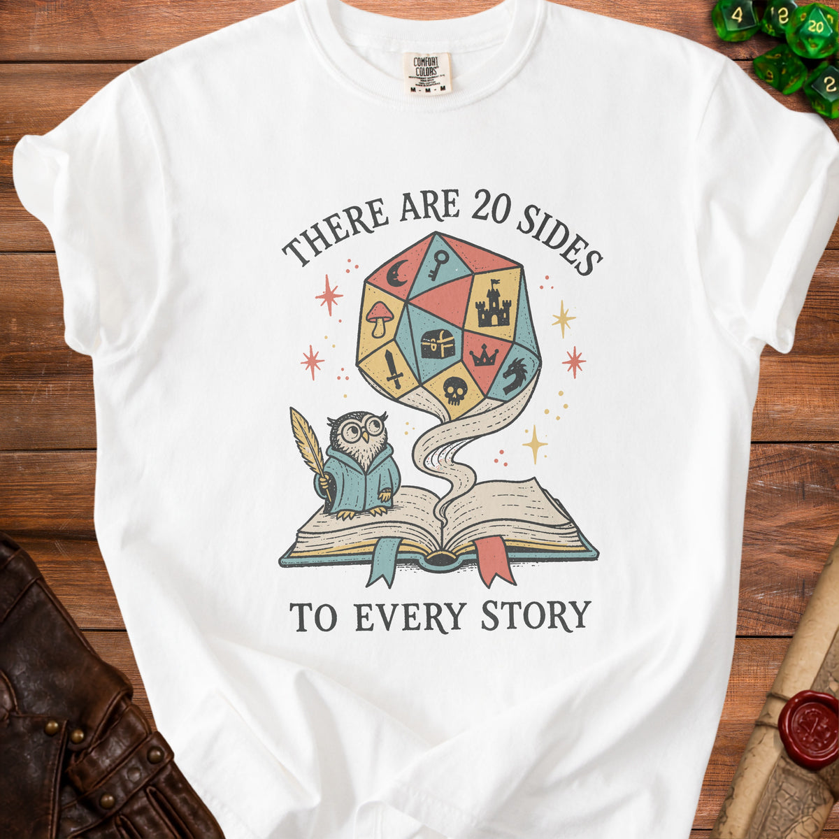 White t-shirt with a graphic of an owl and a d20 die with text "There are 20 sides to every story".
