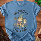 Blue t-shirt with gnome wizard on toilet reading and text "I MUST BE CONSTIPATED THE WAY I DON'T GIVE A SHIT".