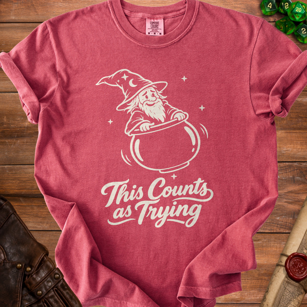 T-shirt with a wizard in a cauldron and text "This Counts as Trying".