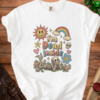 White t-shirt with vintage "I'm Dead Inside" graphic featuring skeletons and retro icons.