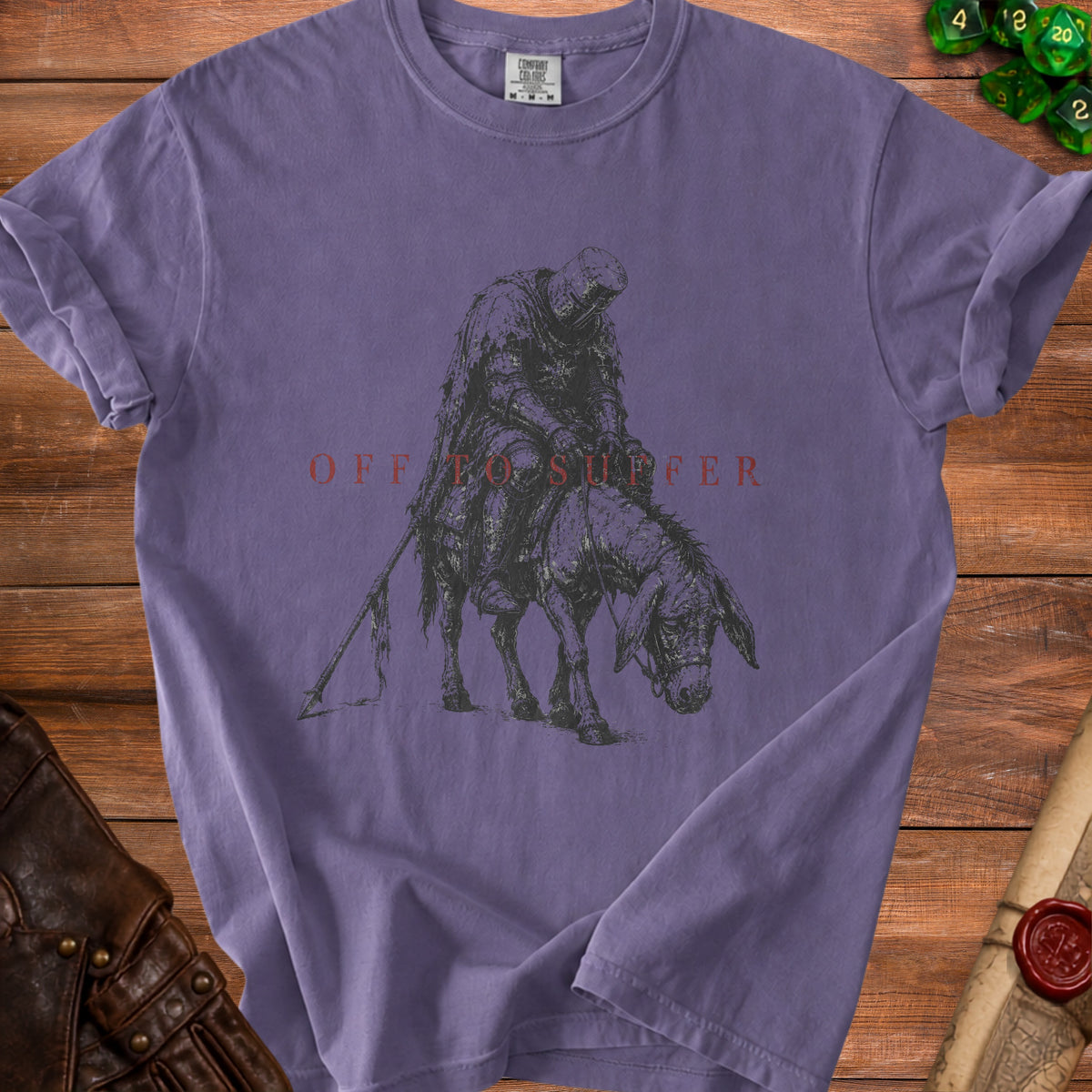 Purple t-shirt featuring knight on donkey with text "OFF TO SUFFER".