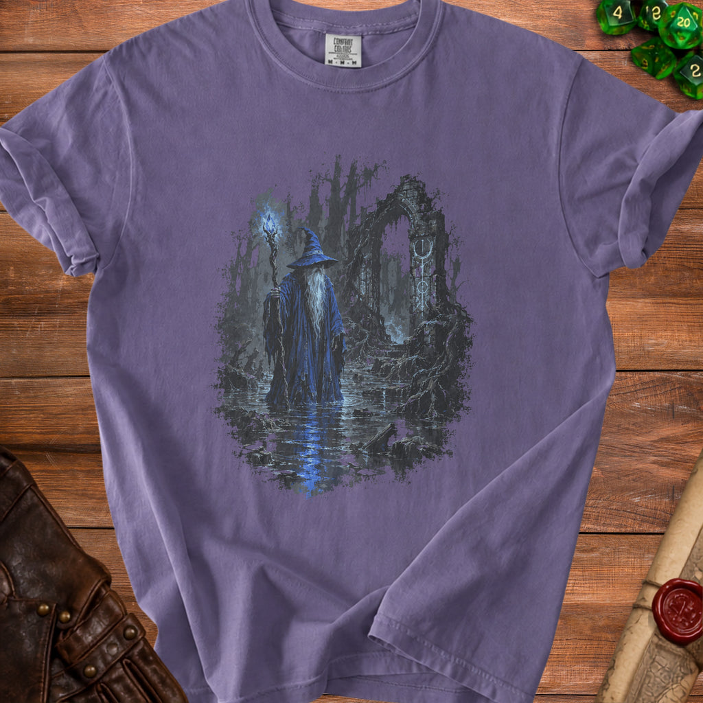 Purple t-shirt with a wizard holding a staff in a swamp with ruins.