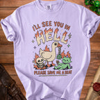 Light purple t-shirt with text "I'LL SEE YOU IN HELL PLEASE SAVE ME A SEAT" and cartoon graphics.