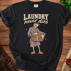 Black t-shirt with skeleton holding a laundry basket, text reads "LAUNDRY never dies".