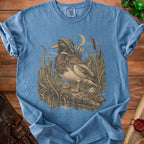 Blue t-shirt with a duck wearing a hooded cloak and quiver of arrows.