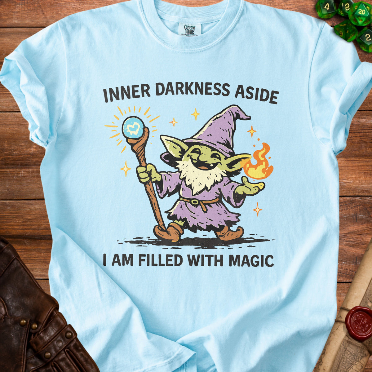 Light blue t-shirt with a cartoon goblin wizard, text reads "INNER DARKNESS ASIDE I AM FILLED WITH MAGIC".