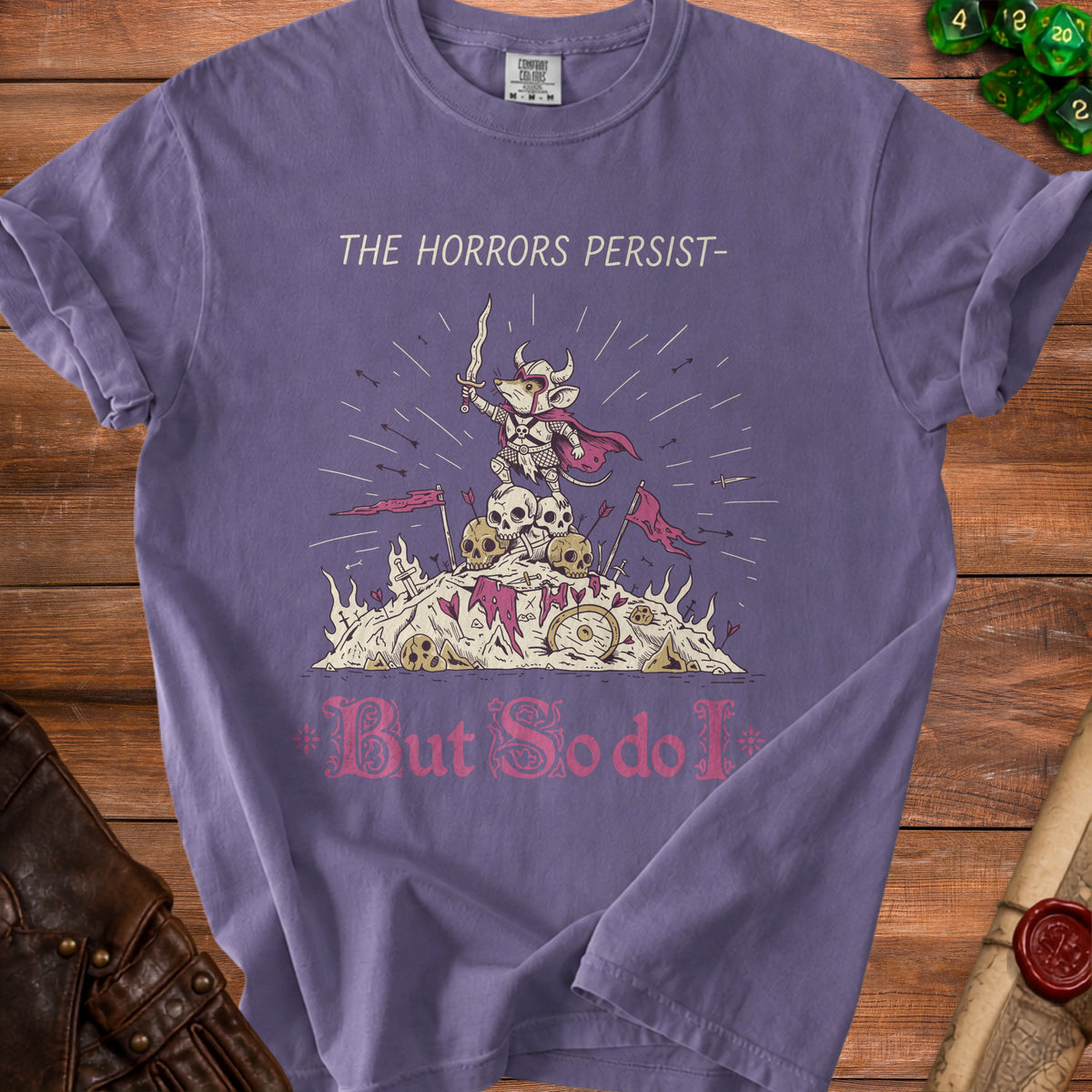 Purple t-shirt with graphic of a warrior mouse on skulls, text reads "THE HORRORS PERSIST- But So do I".