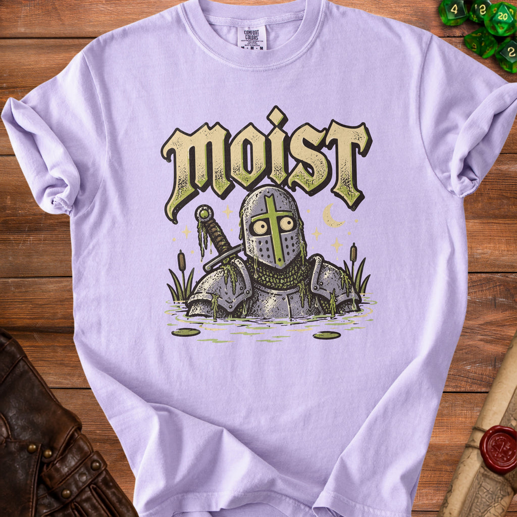 T-shirt with knight in swamp graphic and "moist" text.