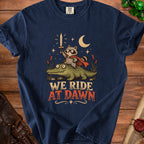 Raccoon with sword rides alligator, text reads "We Ride At Dawn".