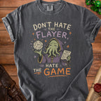 Don't Hate the Flayer, Hate the Game graphic tee with a D20 and character sheet.