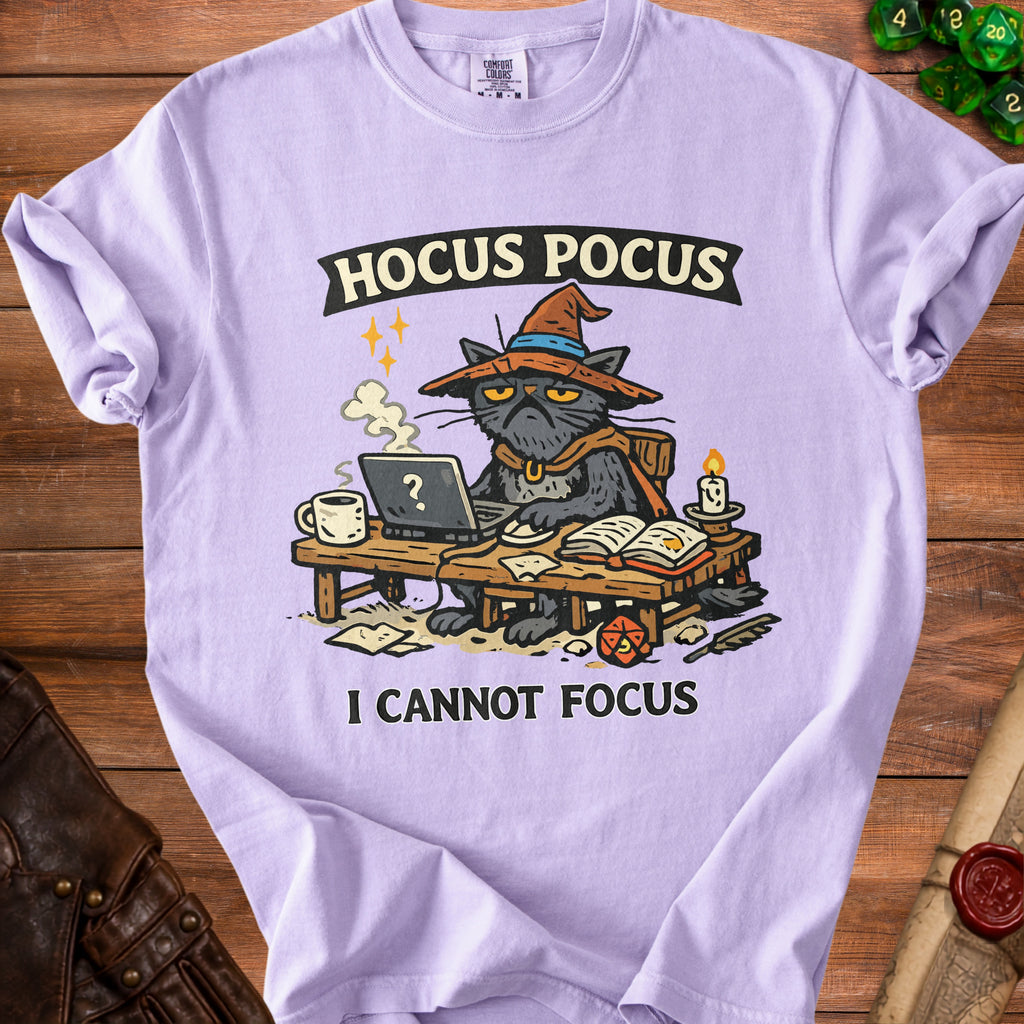 Purple t-shirt with a cartoon cat wearing a witch hat and saying "I CANNOT FOCUS."