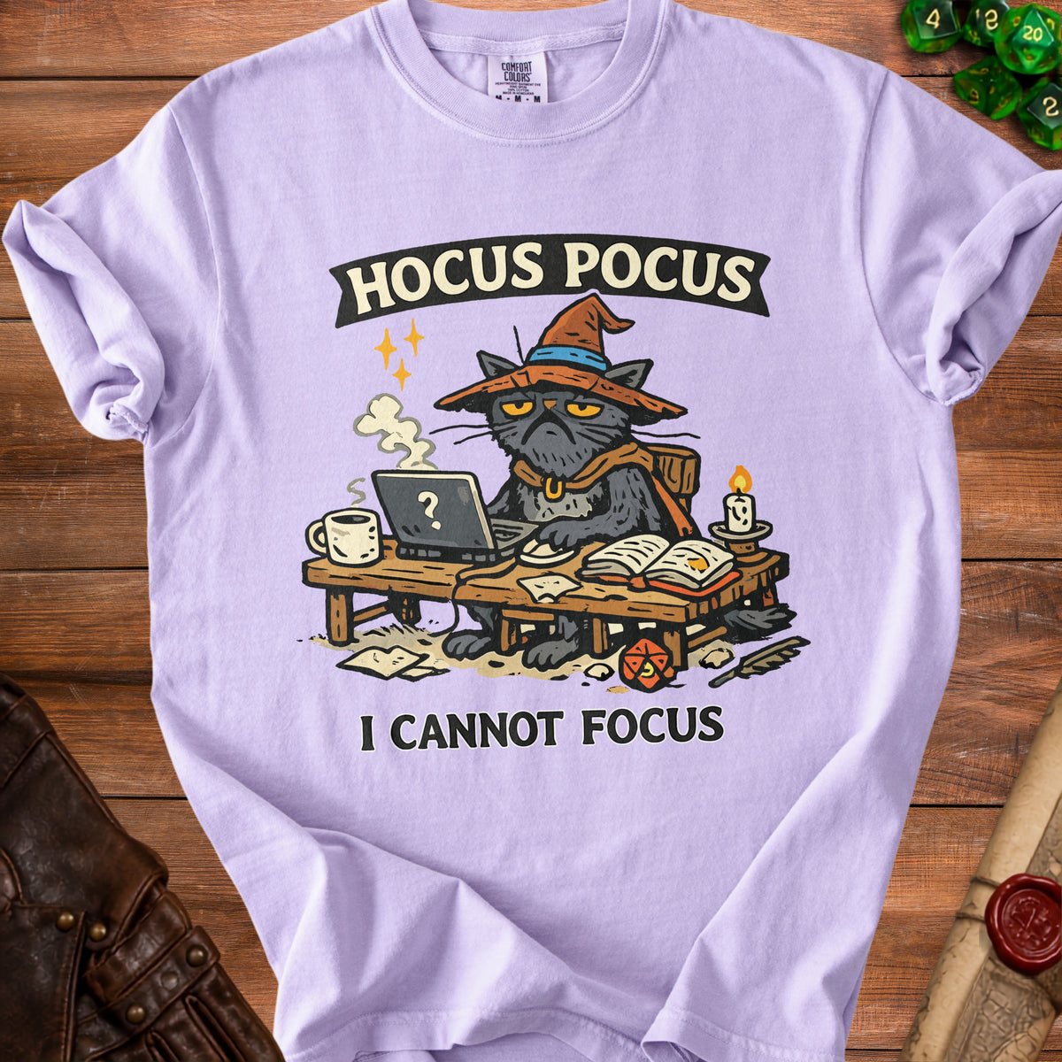 Purple t-shirt with a cartoon cat wearing a witch hat and saying "I CANNOT FOCUS."
