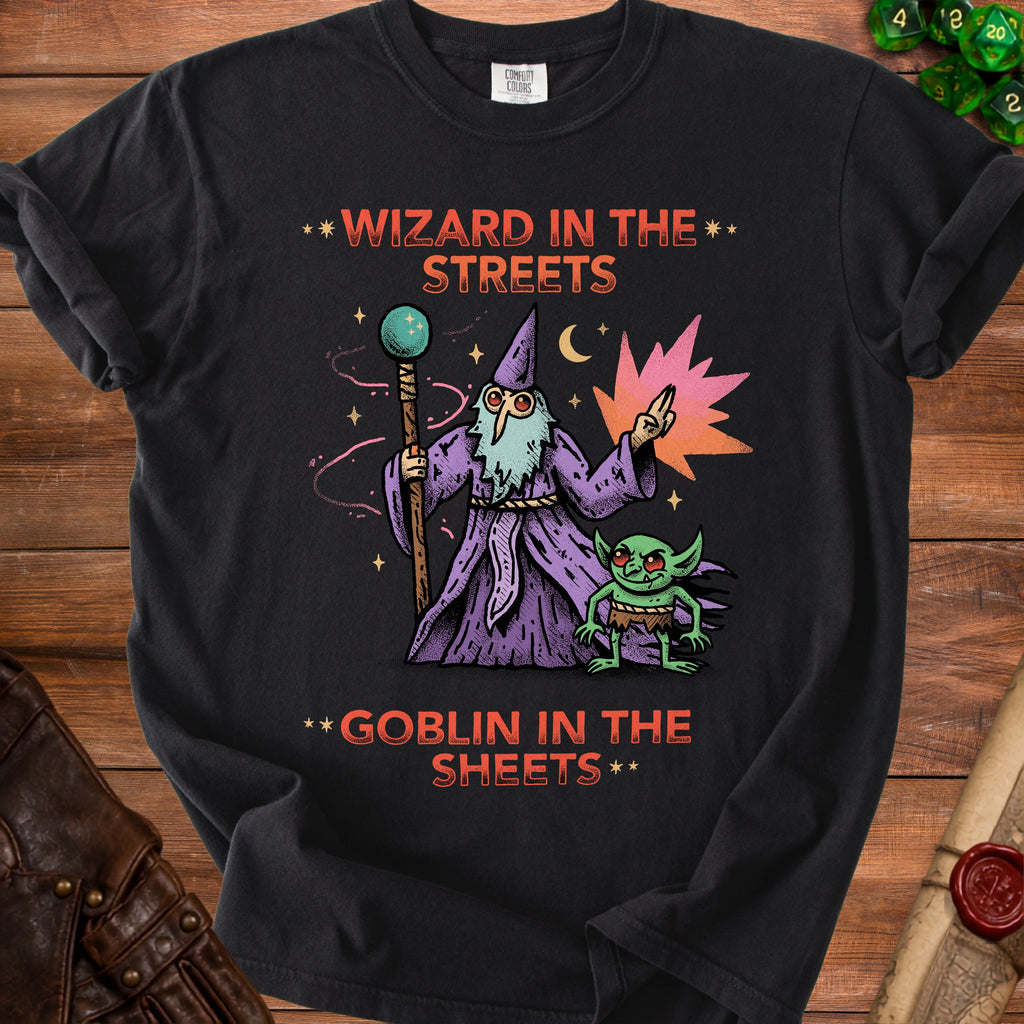 Black t-shirt with illustration of wizard and goblin, text "Wizard in the Streets Goblin in the Sheets".