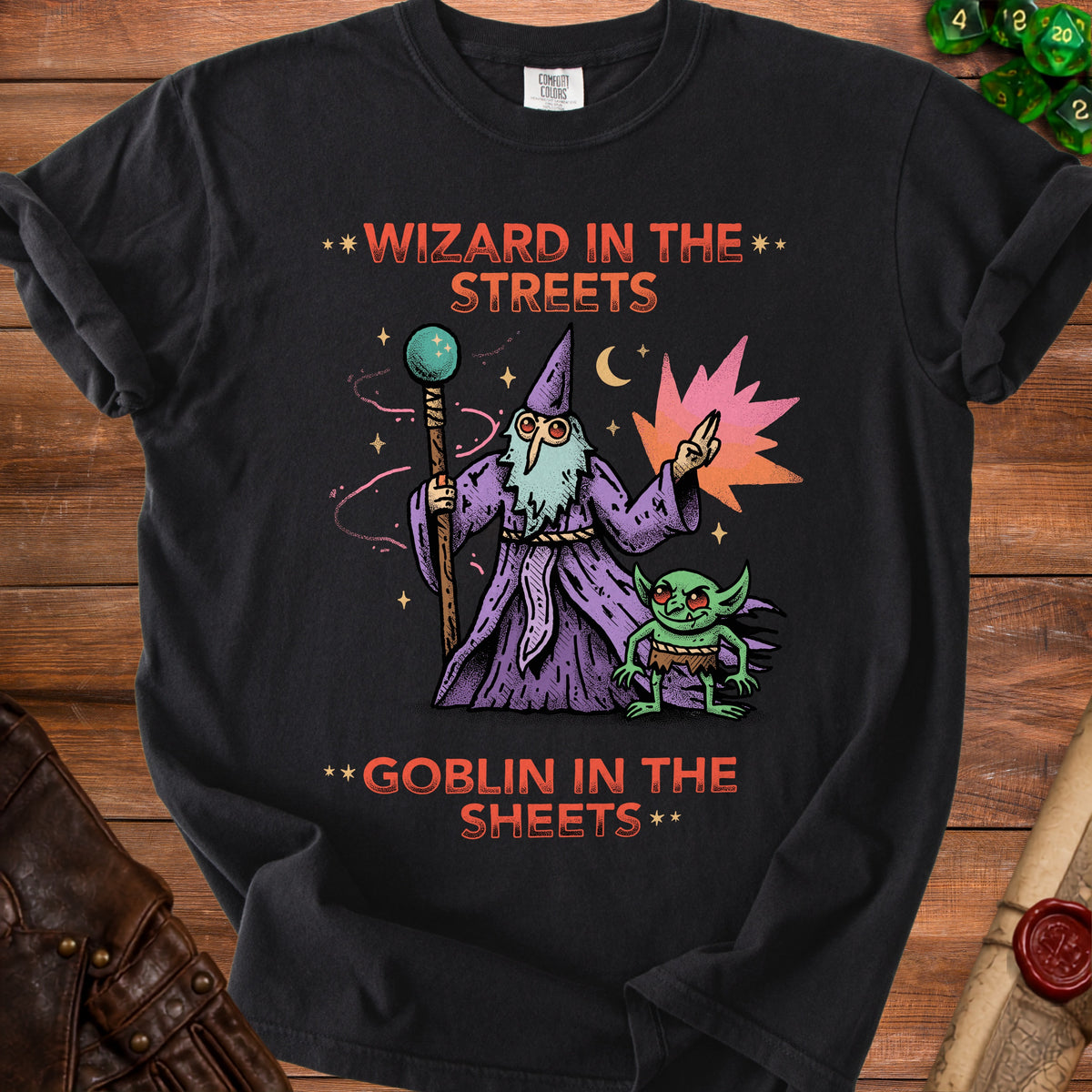 Black t-shirt with illustration of wizard and goblin, text "Wizard in the Streets Goblin in the Sheets".