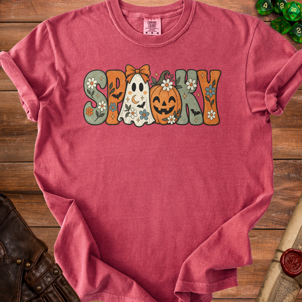 Pink Comfort Colors t-shirt with "Spooky" graphic featuring ghost, pumpkin, and flowers.