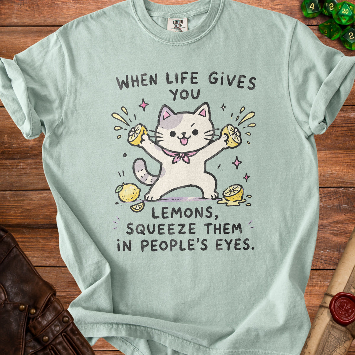 T-shirt with cat squeezing lemons and text "When life gives you lemons, squeeze them in people's eyes."