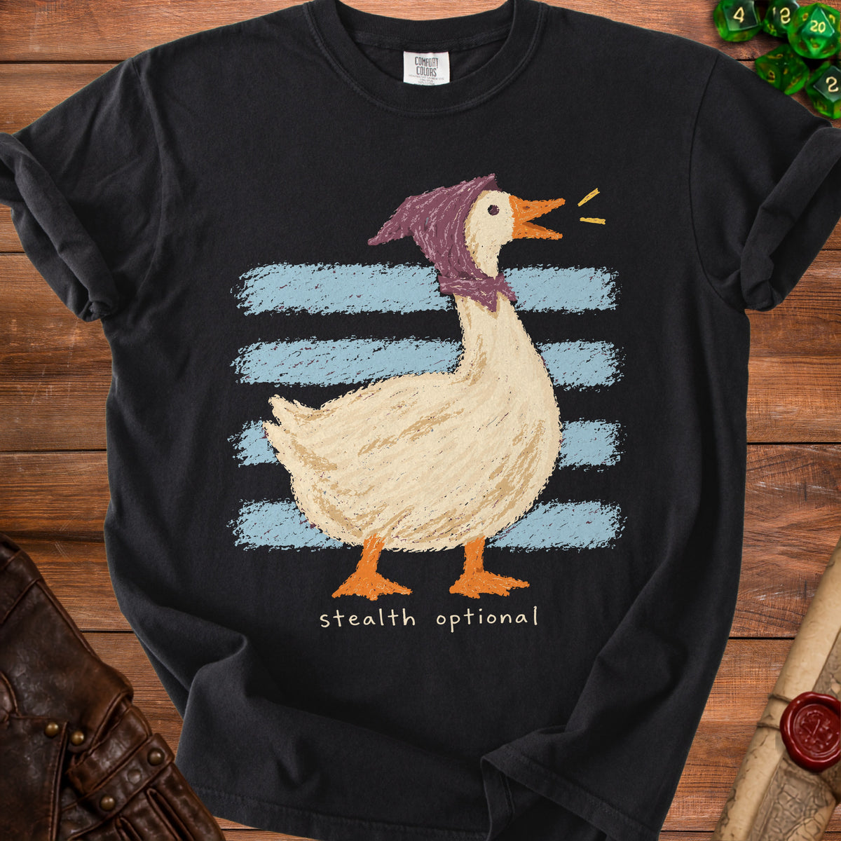 Black t-shirt with a goose graphic wearing a purple scarf and text "stealth optional".